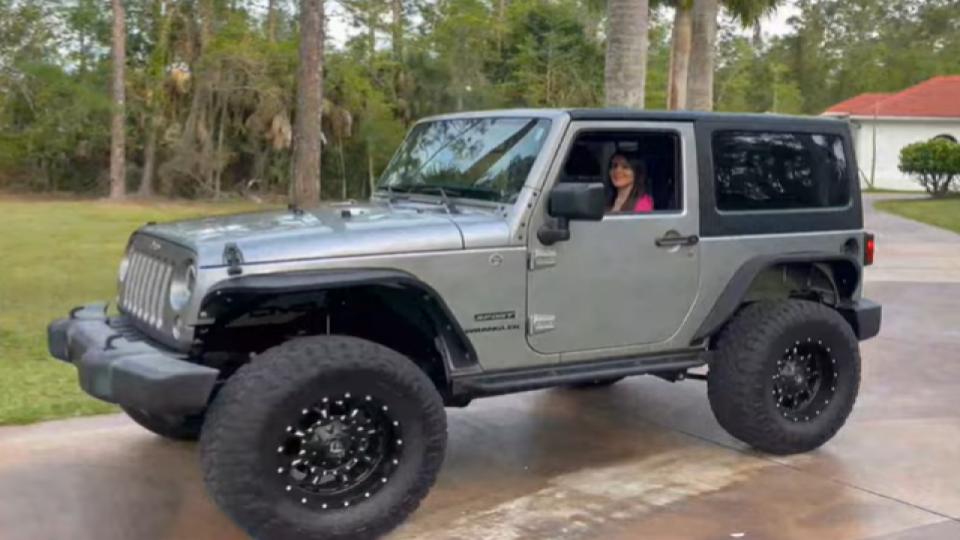 woman driving a 2015 jeep wrangler