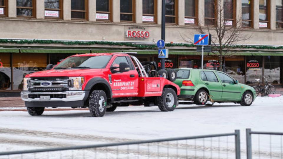 ford f450 truck towing a car